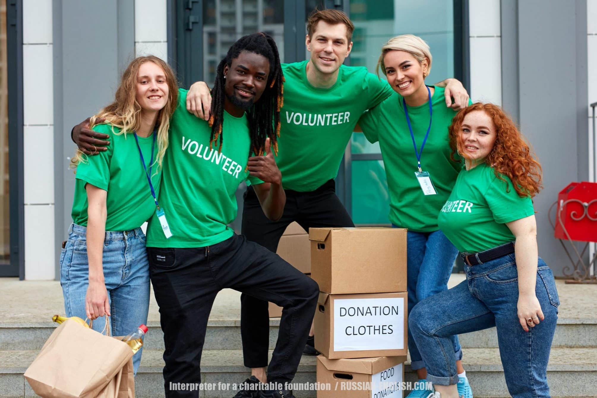 Interpreter for a charitable foundation in London UK, diverse volunteers packing, collecting humanitarian aid in donation box