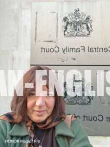 Russian-English interpreter in front of the Central Family Court sign in High Holborn, London